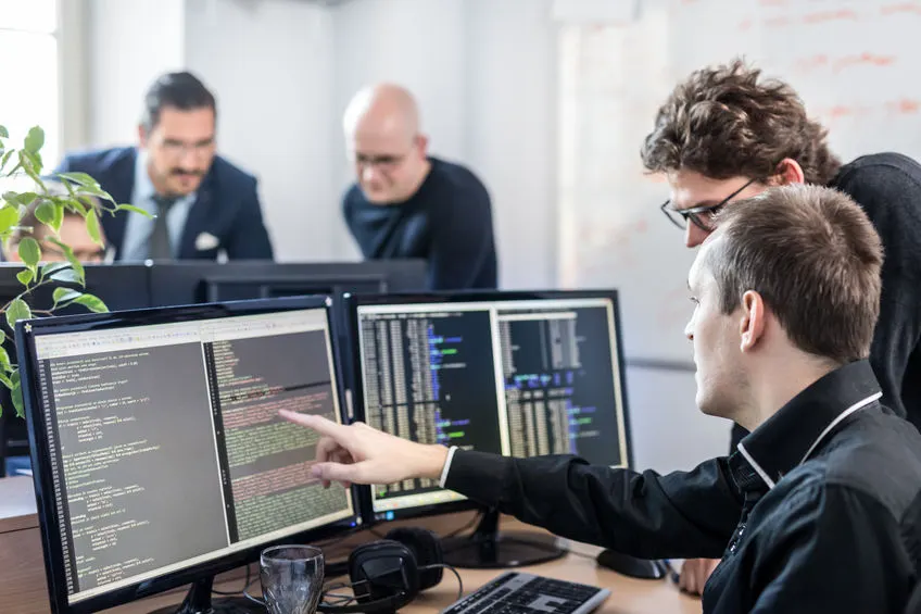 Developer Coding on Screen